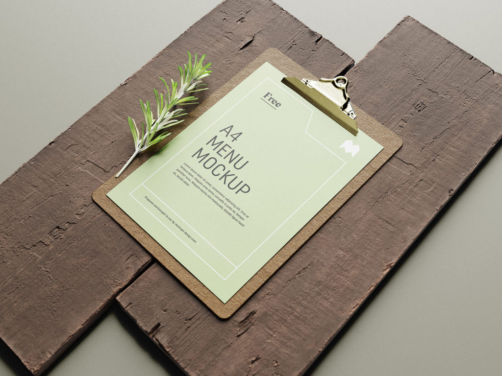 menu mockup free on clipboard and with wood background