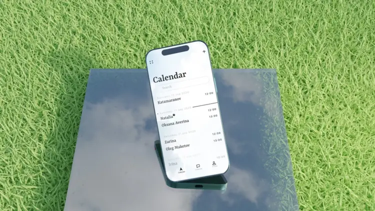 iphone 15 mockup free template on green grass and glass plate